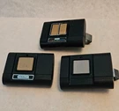 Lot Of 2 - Oem 1050 And 1079 Stanley Garage Door Remotes. Fixed Price $50.00.