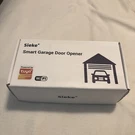 Newoke Smart 2.4G Wifi Garage Door Opener Remote, White. Fixed Price $21.99.