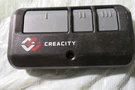 Creacity Door Garage Opener, Remote Control 2A4UK-893MAX. Fixed Price $7.00.